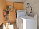 Functional laundry area with a stacked washer and dryer at 2822 Maple Ave, Sarasota, FL 34234