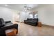 Bright living room with tile flooring, ceiling fan and leather sofa set at 2822 Maple Ave, Sarasota, FL 34234