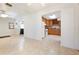 Bright room with tile flooring, ceiling fan, and views to the kitchen and living area at 2822 Maple Ave, Sarasota, FL 34234
