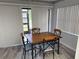 Bright dining area with a wood table, cushioned chairs, and plenty of natural light at 315 30Th W Ave # 101B, Bradenton, FL 34205