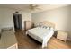 Comfortable bedroom featuring wood floors, wicker furniture, and a ceiling fan at 315 30Th W Ave # 101B, Bradenton, FL 34205