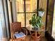 Cozy sunroom featuring wicker furniture, plants, and a glass table perfect for relaxation at 315 30Th W Ave # 101B, Bradenton, FL 34205