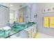 Modern bathroom featuring stylish double sinks with vessel bowls and ample counter space at 4147 Augustine Ave, Sarasota, FL 34231