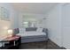 Small bedroom with a pull out bed and a black accent table at 4147 Augustine Ave, Sarasota, FL 34231