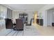 Elegant dining room with modern furniture, stylish decor, and abundant natural light at 4147 Augustine Ave, Sarasota, FL 34231