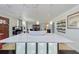 Open-concept kitchen island featuring a stone bowl and stylish glass-front cabinetry at 4147 Augustine Ave, Sarasota, FL 34231