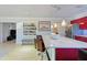 Open-concept kitchen with a large island, red cabinets, modern appliances, and ample counter space at 4147 Augustine Ave, Sarasota, FL 34231