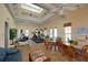 This is a fitness center offering a ceiling fan, skylight, exercise equipment and furniture at 4244 Reflections Pkwy, Sarasota, FL 34233