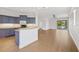 A contemporary kitchen with a breakfast bar, blue cabinets, and new laminate flooring at 4244 Reflections Pkwy, Sarasota, FL 34233