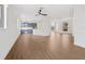 Open floor plan living room with view into the kitchen and sliding doors to the outside at 4244 Reflections Pkwy, Sarasota, FL 34233