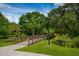 Park bridge surrounded by lush greenery and trees creates a peaceful outdoor experience at 4244 Reflections Pkwy, Sarasota, FL 34233