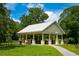 Park pavilion with picnic tables, a grill, and a path leading up to the structure at 4244 Reflections Pkwy, Sarasota, FL 34233