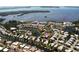 Aerial view shows condos nestled along the bay, with lakes, canals and manicured lawns at 4722 Independence Dr, Bradenton, FL 34210