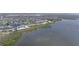 An aerial perspective reveals a waterfront community with a tranquil lakefront setting on the open bay at 4722 Independence Dr, Bradenton, FL 34210