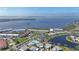 Aerial view showing the community's canal system and bay access, with resort style pool and amenities at 4722 Independence Dr, Bradenton, FL 34210