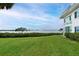 Lush green backyard of home with water views and ample space for outdoor activities at 4722 Independence Dr, Bradenton, FL 34210