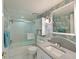 Bathroom featuring wallpaper with a jellyfish pattern, a granite countertop and a shower-tub combination at 4722 Independence Dr, Bradenton, FL 34210