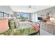 Comfortable bedroom featuring a decorative bed frame and views of the outside scenery at 4722 Independence Dr, Bradenton, FL 34210
