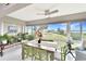 Bright dining room with tile floors, lots of natural light, and scenic waterfront view at 4722 Independence Dr, Bradenton, FL 34210