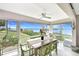 Bright dining room with tile floors, lots of natural light, and scenic waterfront view at 4722 Independence Dr, Bradenton, FL 34210