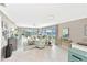 Spacious living room with large windows offering water views, neutral walls, and tile floors at 4722 Independence Dr, Bradenton, FL 34210