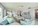 Bright living room featuring coastal decor, comfortable seating, and open layout to the kitchen at 4722 Independence Dr, Bradenton, FL 34210