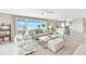 Bright open living room with tile floors, lots of natural light, and scenic waterfront view at 4722 Independence Dr, Bradenton, FL 34210