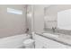 Bathroom with a tiled shower, vanity, and sink with granite countertop, and a toilet at 514 Santiguay St, Punta Gorda, FL 33983