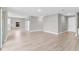 Open living area with wood flooring, a modern barn door, and natural light from a window at 514 Santiguay St, Punta Gorda, FL 33983