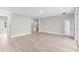 Open living area with wood flooring, recessed lighting, and connections to various rooms at 514 Santiguay St, Punta Gorda, FL 33983