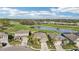 Aerial view of the houses with a lake and golf course in the backyard at 7812 Birdie Bend Way, Sarasota, FL 34241