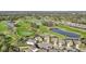 Golf course community featuring beautiful homes, lush greenery, and tranquil ponds, great for recreation at 7812 Birdie Bend Way, Sarasota, FL 34241
