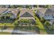 Spacious home with a screened-in lanai and palm trees in a well-maintained community at 7812 Birdie Bend Way, Sarasota, FL 34241