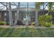 Backyard with decorative rocks, palm trees, and signage designating the 10th hole at 7812 Birdie Bend Way, Sarasota, FL 34241
