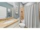 Charming bathroom with granite countertops, shower and tub combo, and stylish fixtures at 7812 Birdie Bend Way, Sarasota, FL 34241