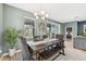 Charming dining room adjacent to living room; perfect for entertaining and Gathering meals at 7812 Birdie Bend Way, Sarasota, FL 34241