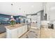 Open-concept kitchen with granite countertops flows into the living area, ideal for entertaining at 7812 Birdie Bend Way, Sarasota, FL 34241