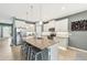 Stylish kitchen featuring stainless steel appliances, granite countertops and a large island at 7812 Birdie Bend Way, Sarasota, FL 34241