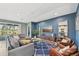 Spacious living room features stylish decor and seamless access to the pool area at 7812 Birdie Bend Way, Sarasota, FL 34241