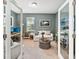 Bright office featuring neutral paint, french doors, carpeted floors, and a desk with dual monitors at 7812 Birdie Bend Way, Sarasota, FL 34241