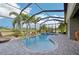 Screened-in pool and spa area offers privacy and tropical landscaping at 7812 Birdie Bend Way, Sarasota, FL 34241