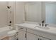 Bathroom with white vanity and shower-tub combo at 12440 Meribel St, Venice, FL 34293