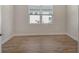 Bedroom features a double window offering natural light and luxury vinyl flooring at 12440 Meribel St, Venice, FL 34293