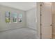 Bedroom featuring natural light from windows and plush carpeting at 12440 Meribel St, Venice, FL 34293