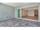Spacious screened-in lanai with a large sliding glass door providing easy access to the home's living area at 12440 Meribel St, Venice, FL 34293