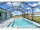 Screened in pool and deck with view of backyard and neighborhood at 12440 Meribel St, Venice, FL 34293