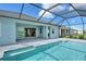 Screened in pool area with beautiful tile and outdoor patio at 12440 Meribel St, Venice, FL 34293
