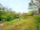 Scenic backyard view with a pond and lush landscaping, offering a serene natural retreat at 1407 Willow Oak Cir, Bradenton, FL 34209
