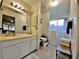 Bathroom with a tub and a view of the beautiful Sarasota outdoors at 1407 Willow Oak Cir, Bradenton, FL 34209