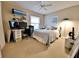 Bedroom with a computer desk, carpet floors and a ceiling fan at 1407 Willow Oak Cir, Bradenton, FL 34209